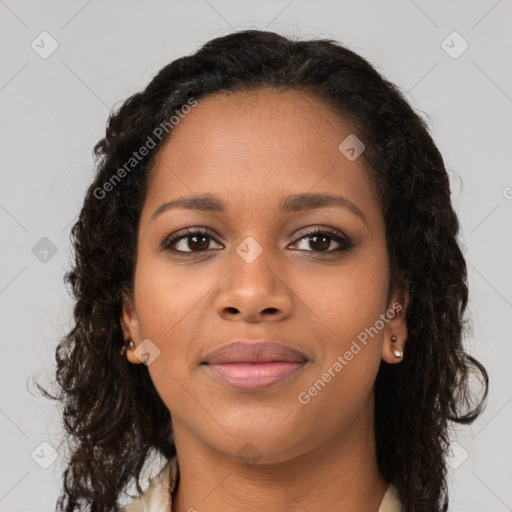 Joyful black young-adult female with long  brown hair and brown eyes