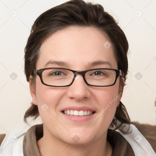 Joyful white young-adult female with medium  brown hair and blue eyes