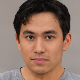 Neutral asian young-adult male with short  brown hair and brown eyes