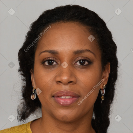 Joyful black young-adult female with long  brown hair and brown eyes