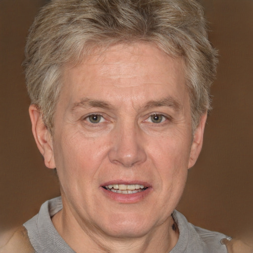 Joyful white middle-aged male with short  gray hair and grey eyes