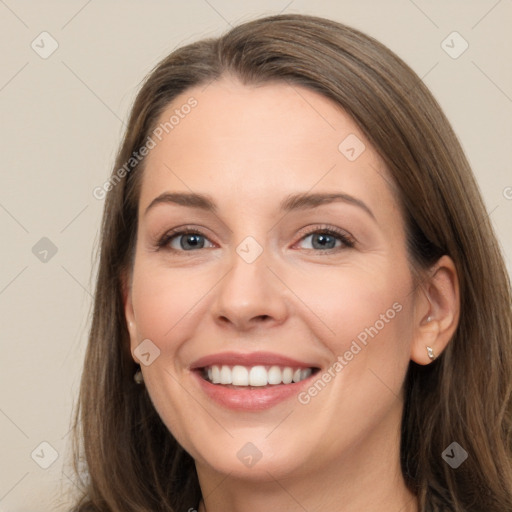 Joyful white young-adult female with long  brown hair and grey eyes