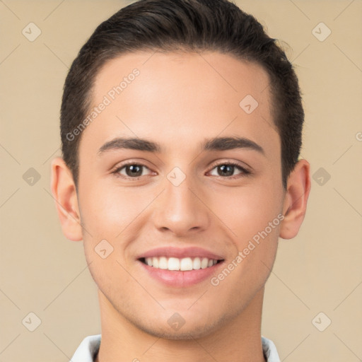 Joyful white young-adult male with short  brown hair and brown eyes