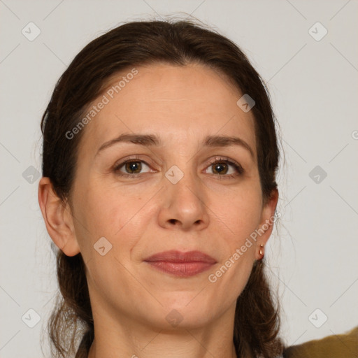 Joyful white adult female with medium  brown hair and grey eyes