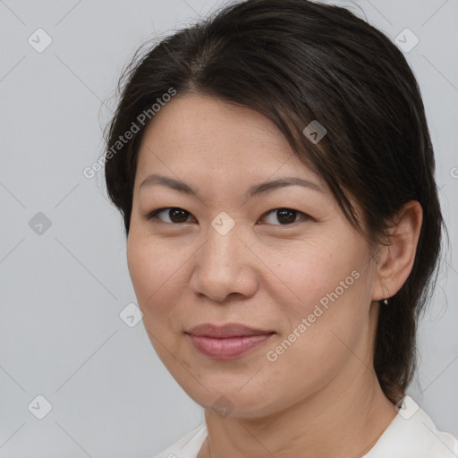 Joyful white adult female with medium  brown hair and brown eyes