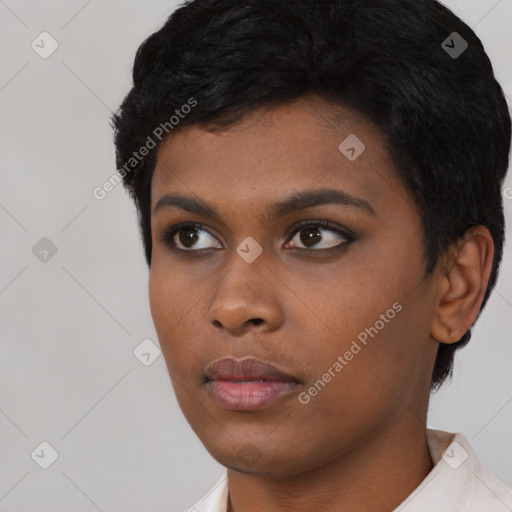 Neutral black young-adult female with short  black hair and brown eyes