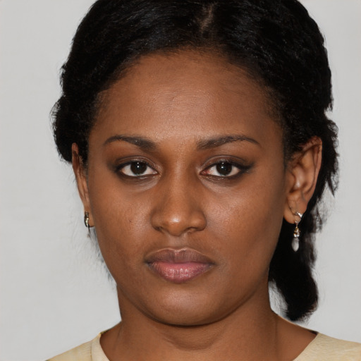Neutral black young-adult female with medium  black hair and brown eyes