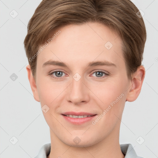 Joyful white young-adult female with short  brown hair and grey eyes