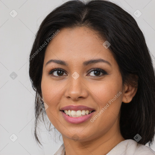 Joyful latino young-adult female with medium  brown hair and brown eyes