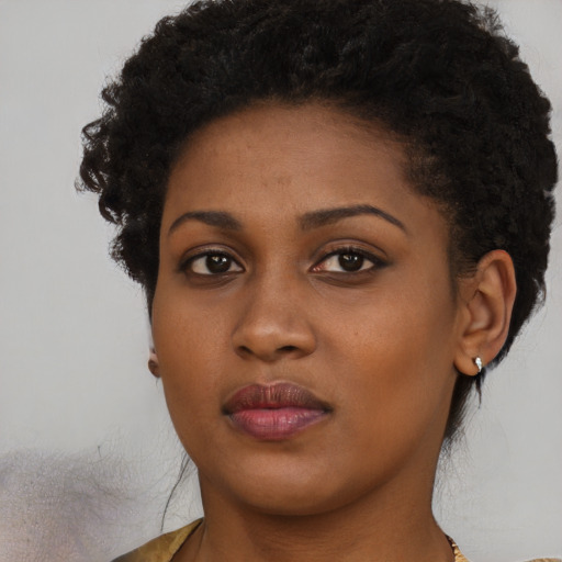 Neutral black young-adult female with short  brown hair and brown eyes