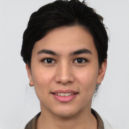 Joyful asian young-adult female with short  black hair and brown eyes