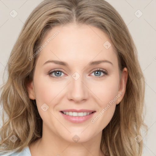 Joyful white young-adult female with long  brown hair and blue eyes