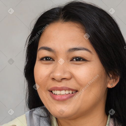 Joyful asian young-adult female with long  brown hair and brown eyes