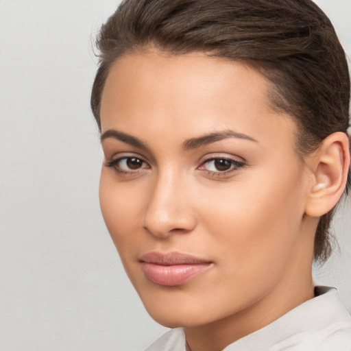 Neutral white young-adult female with medium  brown hair and brown eyes