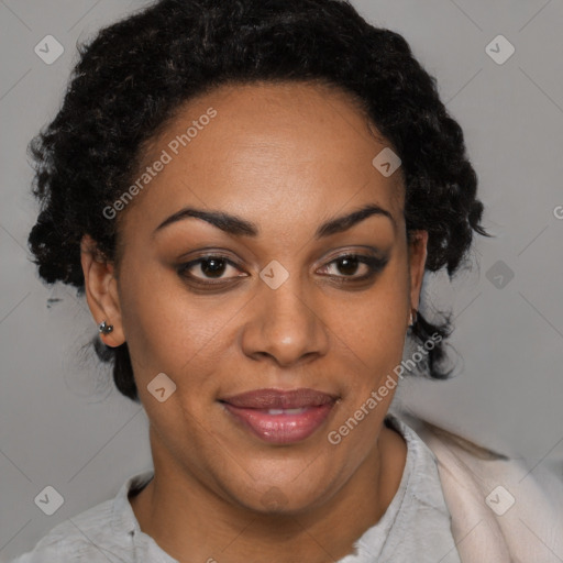 Joyful black adult female with short  brown hair and brown eyes