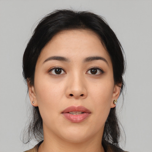 Joyful asian young-adult female with medium  black hair and brown eyes