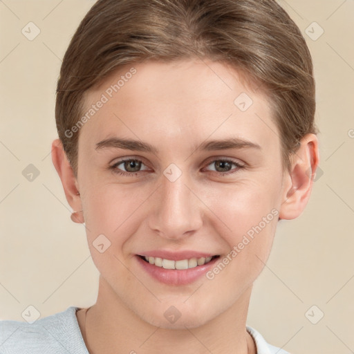 Joyful white young-adult female with short  brown hair and grey eyes