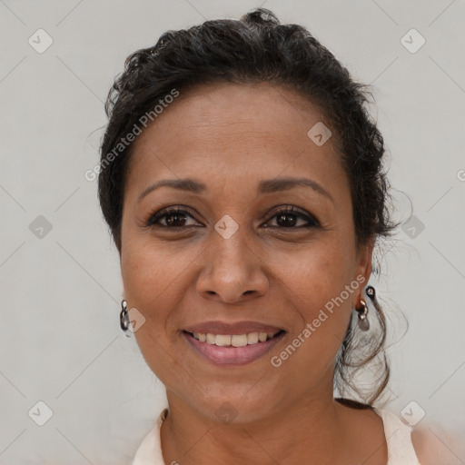 Joyful white adult female with short  brown hair and brown eyes