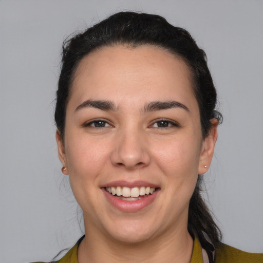 Joyful white young-adult female with medium  brown hair and brown eyes