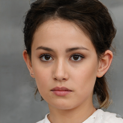 Neutral white young-adult female with medium  brown hair and brown eyes