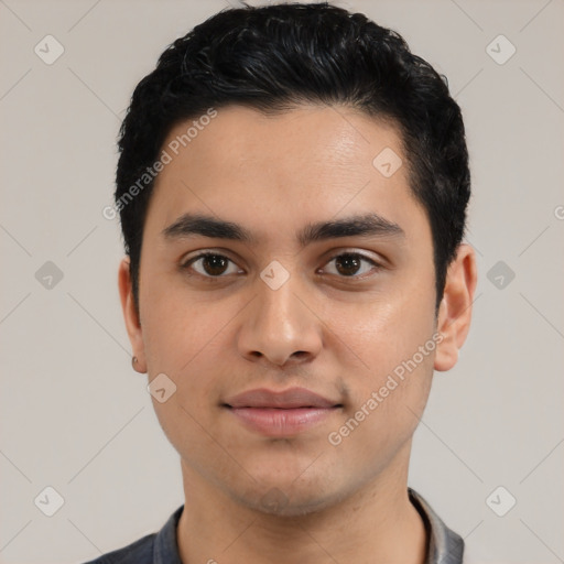 Joyful latino young-adult male with short  black hair and brown eyes