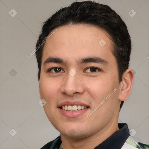 Joyful white young-adult male with short  black hair and brown eyes