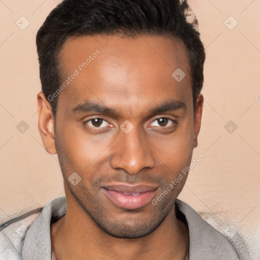 Joyful black young-adult male with short  brown hair and brown eyes