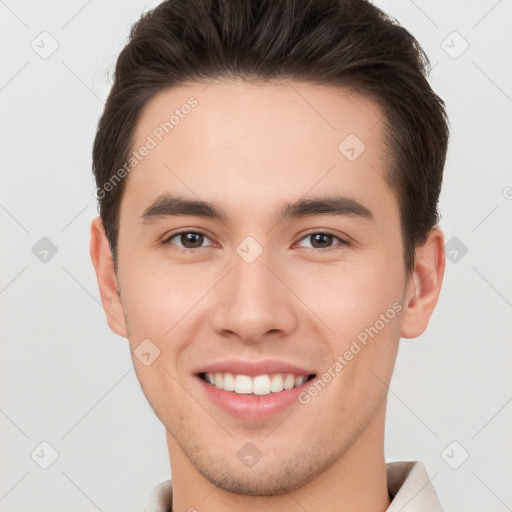 Joyful white young-adult male with short  brown hair and brown eyes