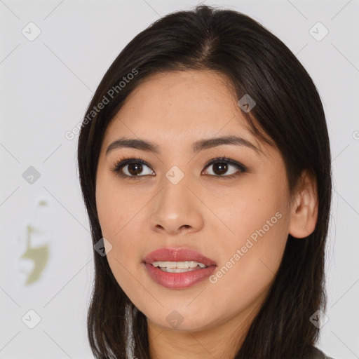 Joyful asian young-adult female with long  brown hair and brown eyes