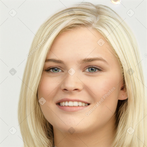 Joyful white young-adult female with long  brown hair and blue eyes