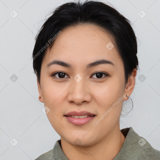 Joyful asian young-adult female with medium  black hair and brown eyes