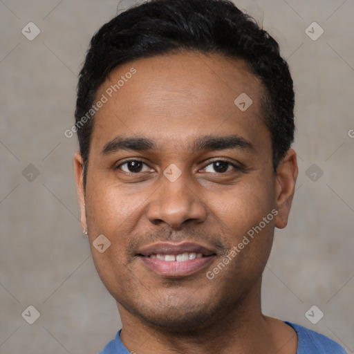 Joyful latino young-adult male with short  black hair and brown eyes