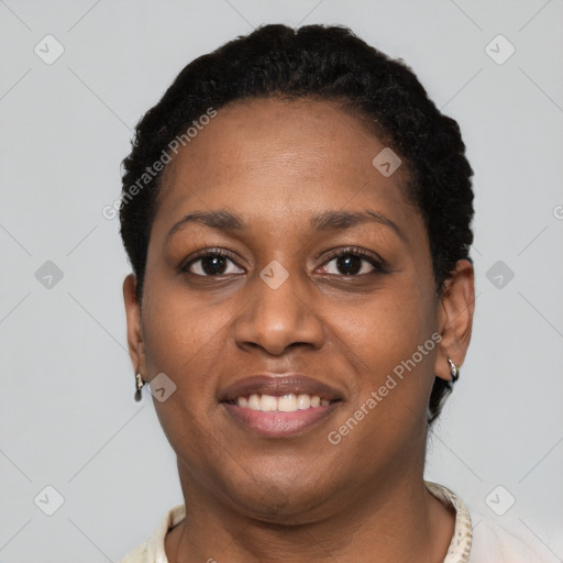 Joyful black young-adult female with short  brown hair and brown eyes