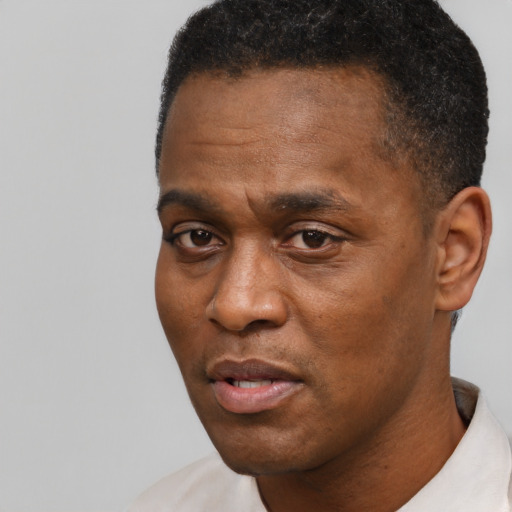 Neutral black young-adult male with short  black hair and brown eyes