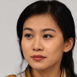 Joyful asian young-adult female with medium  black hair and brown eyes