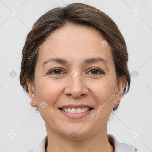 Joyful white adult female with short  brown hair and brown eyes