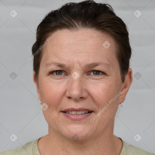 Joyful white adult female with short  brown hair and grey eyes