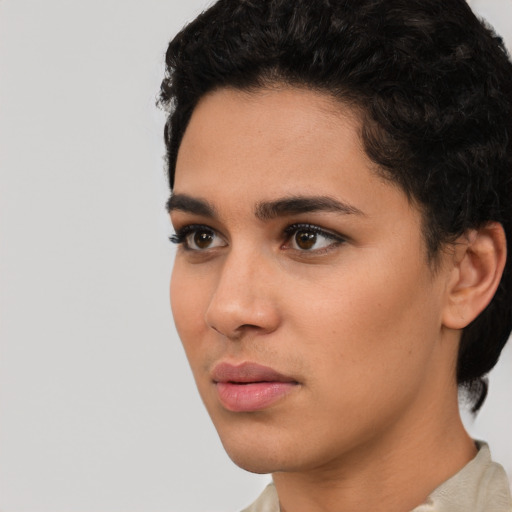 Neutral latino young-adult female with short  black hair and brown eyes