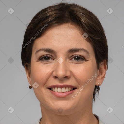 Joyful white adult female with medium  brown hair and brown eyes