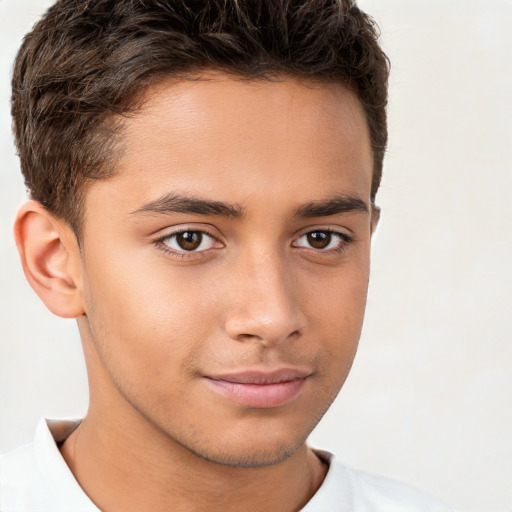 Joyful white child male with short  brown hair and brown eyes