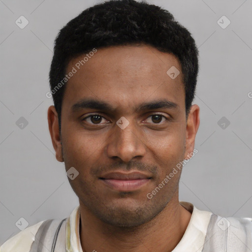 Joyful black young-adult male with short  black hair and brown eyes