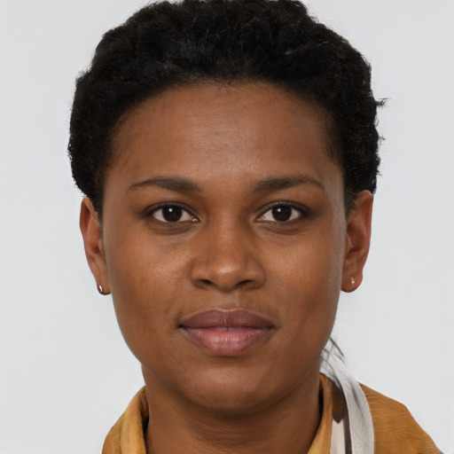 Joyful black young-adult female with short  brown hair and brown eyes