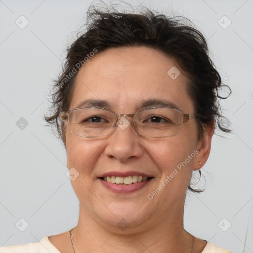 Joyful white adult female with short  brown hair and brown eyes