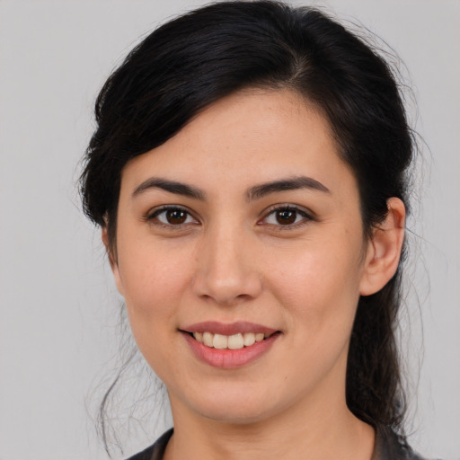 Joyful white young-adult female with medium  brown hair and brown eyes