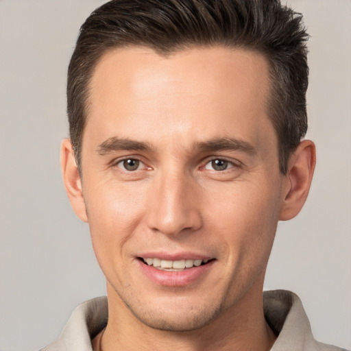 Joyful white young-adult male with short  brown hair and brown eyes