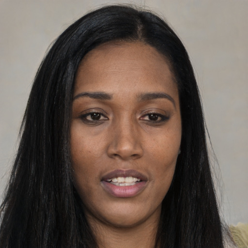 Joyful asian young-adult female with long  black hair and brown eyes