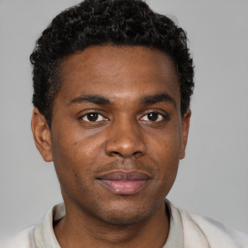 Neutral black young-adult male with short  brown hair and brown eyes