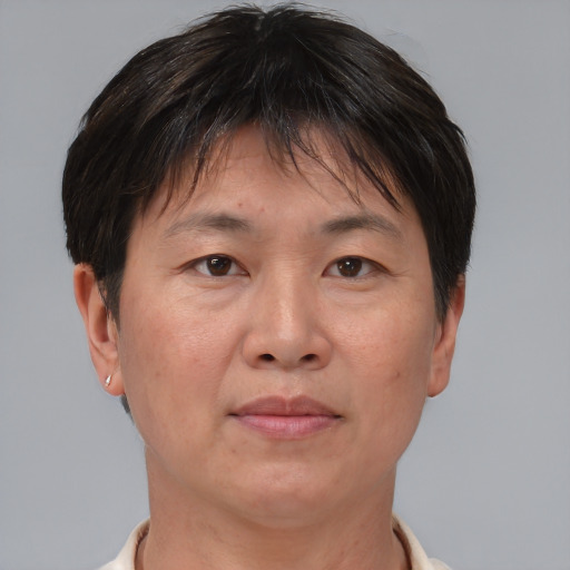 Joyful asian adult female with short  brown hair and brown eyes
