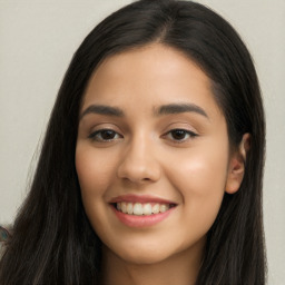 Joyful latino young-adult female with long  black hair and brown eyes