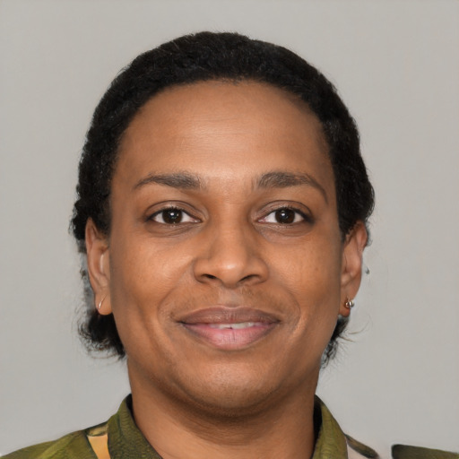 Joyful latino adult female with short  brown hair and brown eyes